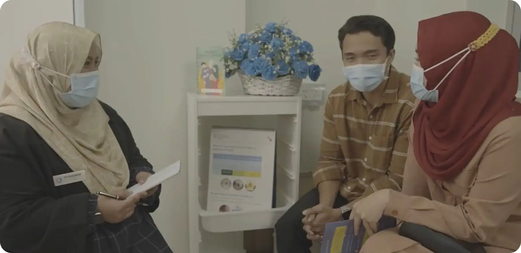 Healthcare consultation with masked people.