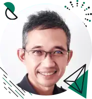 Smiling person with glasses and short hair